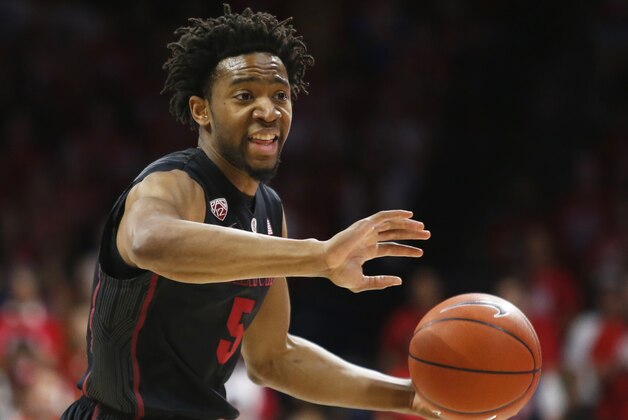 Stanford guard Chasson Randle (5) drives on Arizona during the first half of an NCAA college basketball game, Saturday, March 7, 2015, in Tucson, Ariz. (AP Photo/Rick Scuteri)