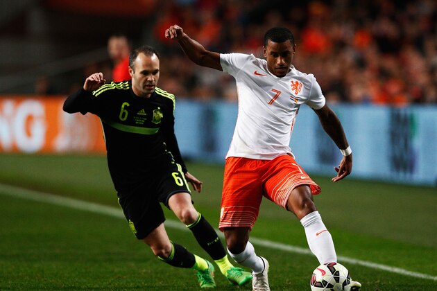 AMSTERDAM, NETHERLANDS - MARCH 31: Luciano Narsingh of Netherlands is closed down by Andres Iniesta of Spain during the international friendly match between the Netherlands and Spain held at Amsterdam Arena on March 31, 2015 in Amsterdam, Netherlands.  (Photo by Dean Mouhtaropoulos/Getty Images)
