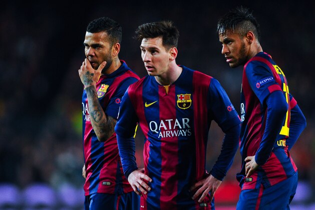 BARCELONA, SPAIN - MARCH 18:  (L-R) Dani Alves, Lionel Messi and Neymar of FC Barcelona look on during the UEFA Champions League round of 16 second leg match between FC Barcelona and Manchester City at the Camp Nou stadium on March 18, 2015 in Barcelona, Spain.  (Photo by David Ramos/Getty Images)