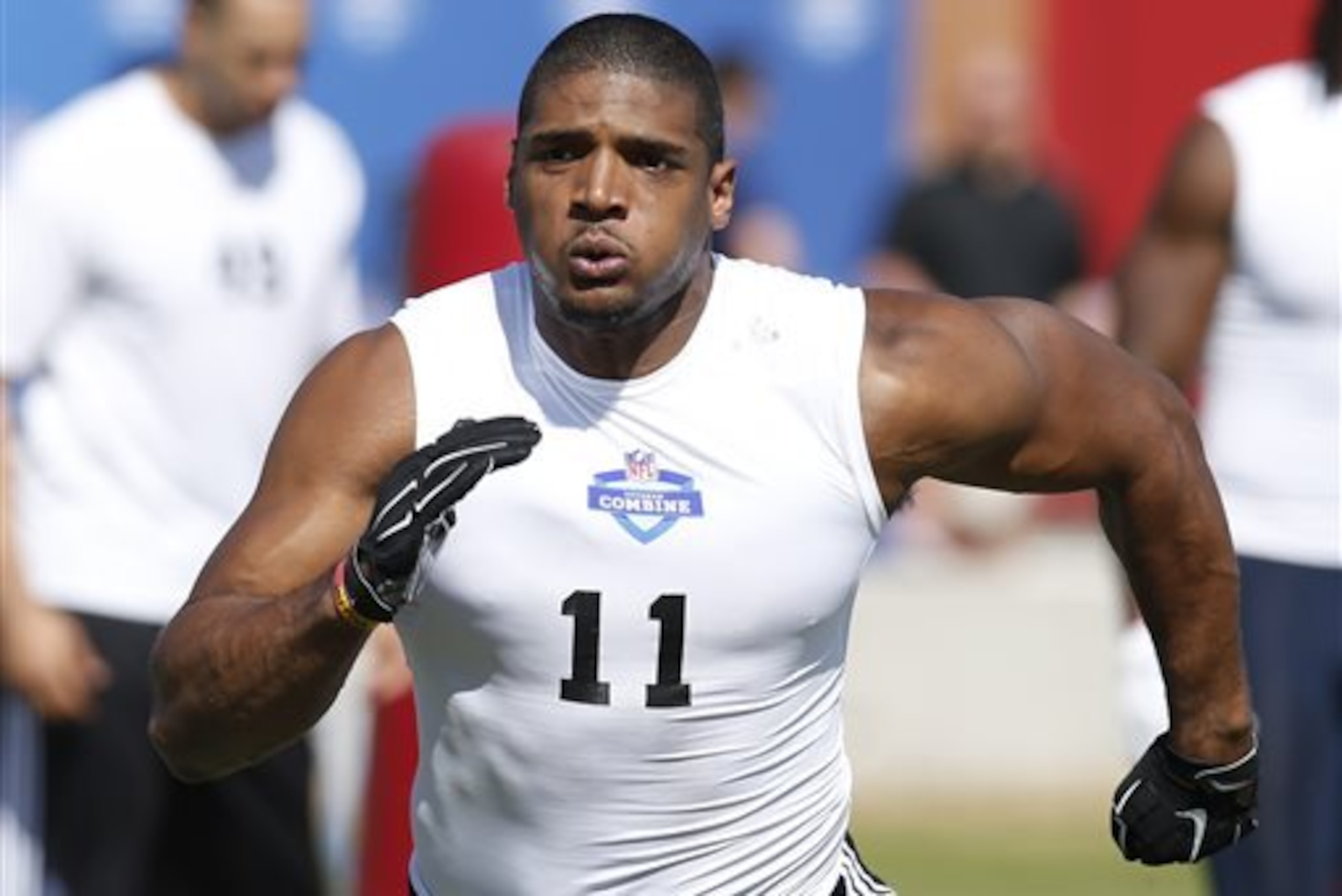 Defensive End Michael Sam, from Missouri, runs through a drill during the NFL Super Regional Combine football workout, Sunday, March 22, 2015, in Tempe, Ariz. (AP Photo/Rick Scuteri)