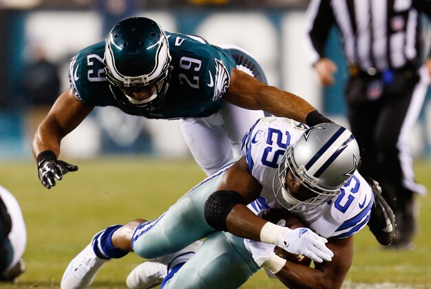 Dec 14, 2014; Philadelphia, PA, USA; Philadelphia Eagles strong safety Nate Allen (29) tackles Dallas Cowboys running back DeMarco Murray (29) during the first half at Lincoln Financial Field. Mandatory Credit: Bill Streicher-USA TODAY Sports