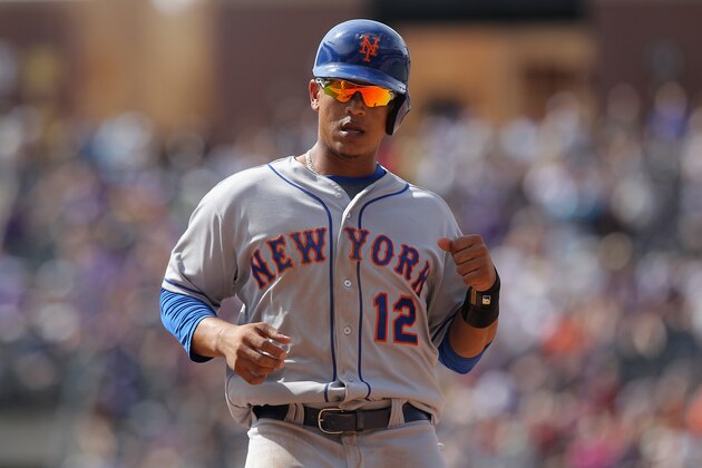 DENVER, CO - MAY 04:  Juan Lagares #12 of the New York Mets runs the bases against the Colorado Rockies at Coors Field on May 4, 2014 in Denver, Colorado. The Mets defeated the Rockies 5-1.  (Photo by Doug Pensinger/Getty Images)