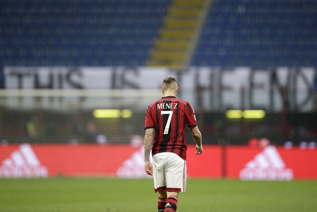 AC Milan's Jeremy Menez walks after scoring during the Serie A soccer match between AC Milan and Cagliari at the San Siro stadium in Milan, Italy, Saturday, March 21, 2015. (AP Photo/Antonio Calanni)
