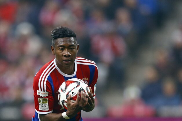 Bayern's David Alaba from Austria catches the ball during the German first division Bundesliga soccer match between FC Bayern Munich and Borussia Moenchengladbach in the Allianz Arena in Munich, Germany, on Sunday, March 22, 2015. (AP Photo/Matthias Schrader)