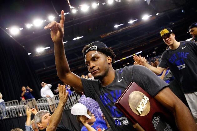 HOUSTON, TX - MARCH 29:  Justise Winslow #12 of the Duke Blue Devils walks off the court with the trophy after defeating the Gonzaga Bulldogs 66-52 in the South Regional Final of the 2015 NCAA Men's Basketball Tournament at NRG Stadium on March 29, 2015 in Houston, Texas.  (Photo by Tom Pennington/Getty Images)