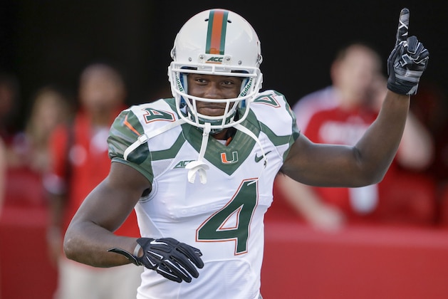 Miami wide receiver Phillip Dorsett (4) raises his hand before an NCAA college football game against Nebraska in Lincoln, Neb., Saturday, Sept. 20, 2014. (AP Photo/Nati Harnik)