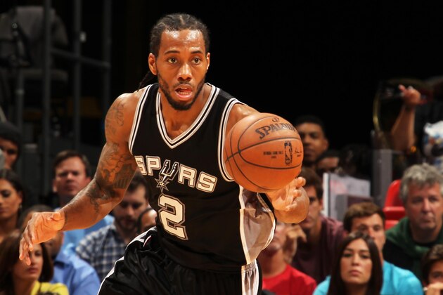 MIAMI, FL - MARCH 31:  Kawhi Leonard #2 of the San Antonio Spurs handles the ball against the Miami Heat on March 31, 2015 at American Airlines Arena in Miami, Florida.  NOTE TO USER: User expressly acknowledges and agrees that, by downloading and or using this Photograph, user is consenting to the terms and conditions of the Getty Images License Agreement. Mandatory Copyright Notice: Copyright 2015 NBAE (Photo by Issac Baldizon/NBAE via Getty Images)