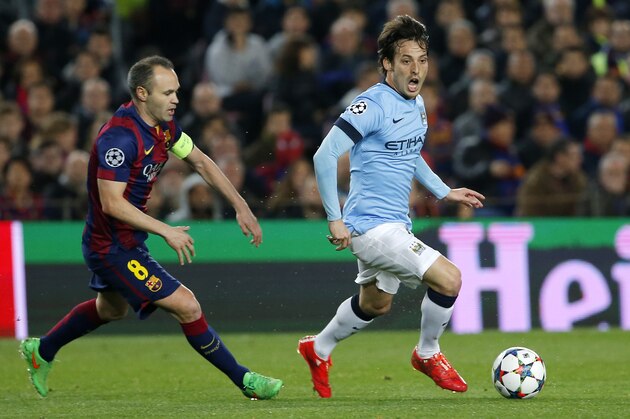 Manchester City's David Silva, right, controls the ball past Barcelona's Andres Iniesta during a Champions League round of 16 second leg, soccer match between FC Barcelona and Manchester City at Camp Nou stadium, in Barcelona, Spain, Wednesday, March 18, 2015. (AP Photo/Emilio Morenatti)