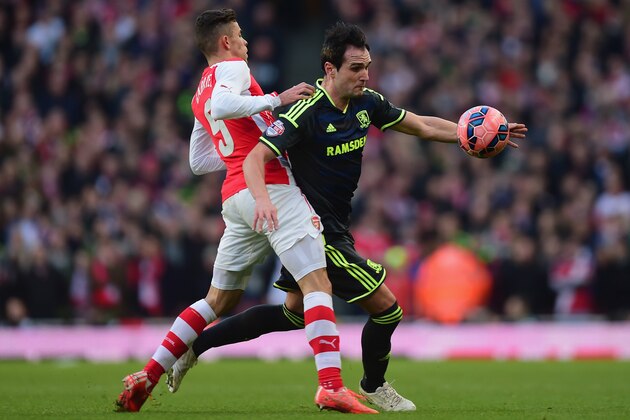 LONDON, ENGLAND - FEBRUARY 15:  Gabriel Paulista of Arsenal challenges Kike of Middlesbrough during the FA Cup fifth round match between Arsenal and Middlesbrough at Emirates Stadium on February 15, 2015 in London, England.  (Photo by Jamie McDonald/Getty Images)