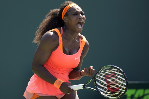 Serena Williams celebrates after defeating Sabine Lisicki, of Germany, during their match at the Miami Open tennis tournament in Key Biscayne, Fla., Wednesday, April 1, 2015. Williams won 7-6 (4), 1-6, 6-3. (AP Photo/J Pat Carter)