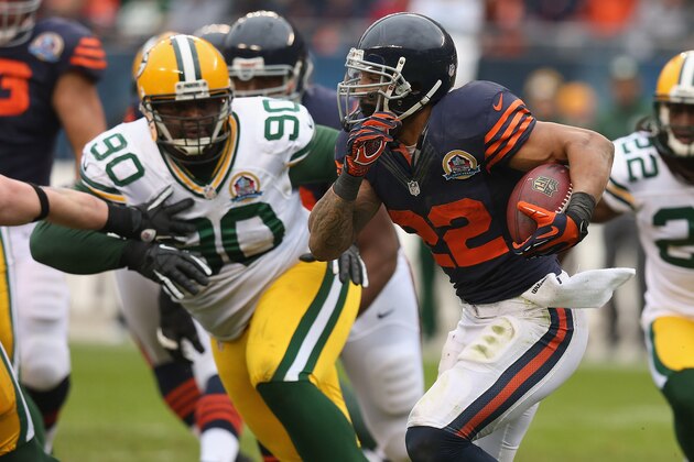 CHICAGO, IL - DECEMBER 16: Matt Forte #22 of the Chicago Bears is chased by B.J. Raji #90 of the Green Bay Packers at Soldier Field on December 16, 2012 in Chicago, Illinois. The Packers defeated the Bears 21-13. (Photo by Jonathan Daniel/Getty Images)