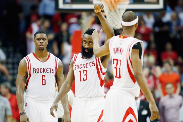HOUSTON, TX - APRIL 01:  James Harden #13 of the Houston Rockets celebrates a three-point shot with teammates Corey Brewer #33 during their game against the Sacramento Kings at the Toyota Center on April 1, 2015 in Houston, Texas. NOTE TO USER: User expressly acknowledges and agrees that, by downloading and/or using this photograph, user is consenting to the terms and conditions of the Getty Images License Agreement.  (Photo by Scott Halleran/Getty Images)