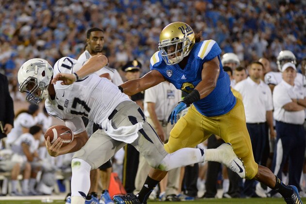 PASADENA, CA - AUGUST 31:  Cody Fajardo #17 of the Nevada Wolf Pack is knocked out of bounds by Eric Kendricks #6 of the UCLA Bruins during the first quarter at Rose Bowl on August 31, 2013 in Pasadena, California.  (Photo by Harry How/Getty Images)