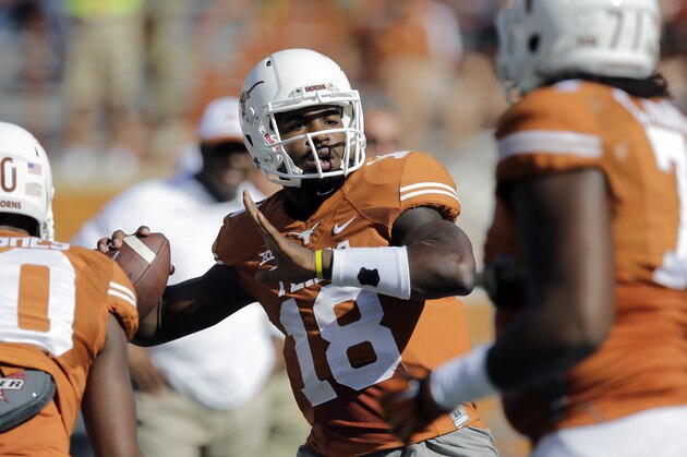 Texas’ Tyrone Swoopes (18) warms up prior to an NCAA college football game against West Virginia, Saturday, Nov. 8, 2014, in Austin, Texas. (AP Photo/Eric Gay)