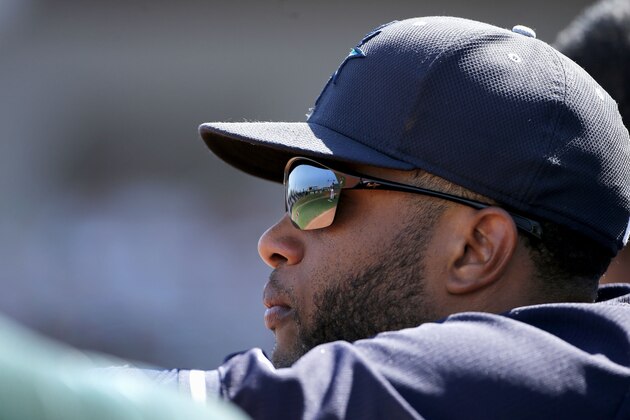 Seattle Mariners' Robinson Cano watches the action on the field during the second inning of a spring training baseball game against the Cleveland Indians Tuesday, March 31, 2015, in Goodyear, Ariz. (AP Photo/Ross D. Franklin)