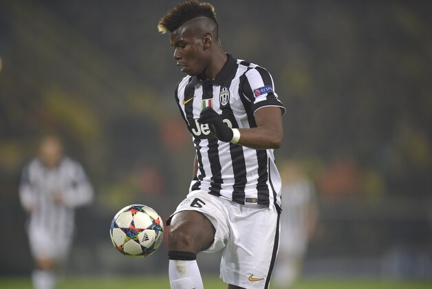 Juventus' Paul Pogba controls a ball during the Champions League round of 16 second leg soccer match between Borussia Dortmund and Juventus Turin on Wednesday, March 18, 2015 in Dortmund, Germany. (AP Photo/Martin Meissner)