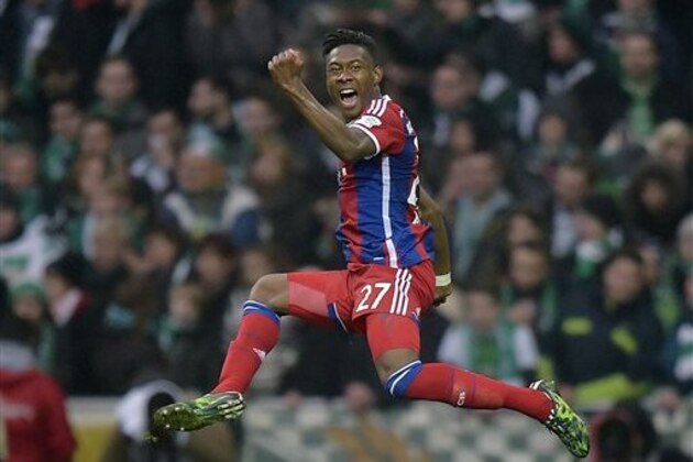 Bayern's David Alaba from Austria celebrates after scoring a free kick goal during the German Bundesliga soccer match between Werder Bremen and Bayern Munich in Bremen, Germany, Saturday, March 14, 2015. (AP Photo/Martin Meissner)