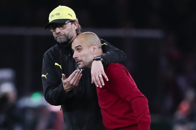 Dortmund head coach Juergen Klopp, left, congratulates Bayern head coach Pep Guardiola of Spain after he wins with his team the German Soccer Cup Final between FC Bayern Munich and Borussia Dortmund at the Olympic Stadium Berlin, Germany, Saturday, May 17, 2014. (AP Photo/Markus Schreiber)