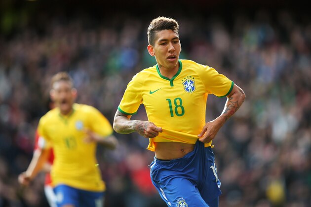 LONDON, ENGLAND - MARCH 29:  Firmino of Brazil celebrates after scoring the opening goal during the international friendly match between Brazil and Chile at the Emirates Stadium on March 29, 2015 in London, England.  (Photo by Paul Gilham/Getty Images)