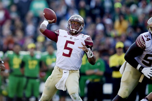 Florida State quarterback Jameis Winston (5) throws a pass while facing Oregon in the Rose Bowl NCAA college football playoff semifinal, Thursday, Jan. 1, 2015 in Pasadena, Calif. Oregon defeated Florida State 59-20 to advance to the first ever NCAA football playoff championship game. (AP Photo/Doug Benc)