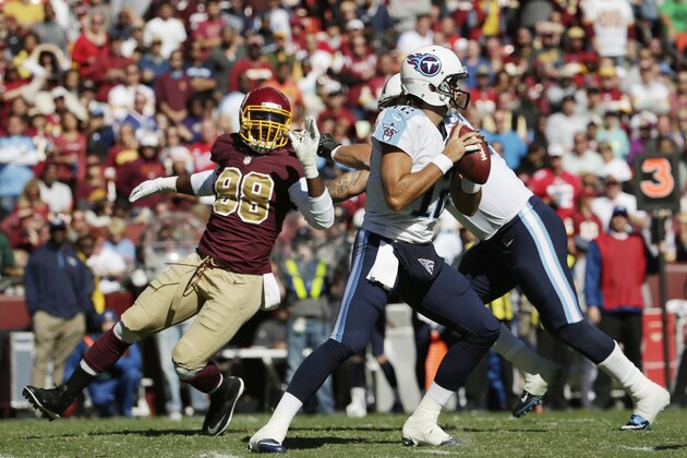 Washington Redskins linebacker Brian Orakpo (98) goes after Tennessee Titans quarterback Charlie Whitehurst (12) but is covered by Taylor Lewan (77) during the second half of a NFL football game Sunday, Oct. 19, 2014. at Fedex Field in Landover, MD. (AP Photo/Pablo Martinez Monsivais) Washington Redskins linebacker Brian Orakpo (98) goes after Tennessee Titans quarterback Charlie Whitehurst (12) but is covered by Taylor Lewan (77) during the second half of a NFL football game Sunday, Oct. 19, 2014. at Fedex Field in Landover, MD. (AP Photo/Pablo Martinez Monsivais)
