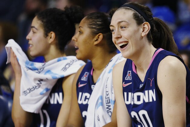 Connecticut forward Breanna Stewart smiles on the bench in the second half of an NCAA college basketball game against Tulsa in Tulsa, Okla., Saturday, Feb. 21, 2015. Connecticut won 92-46. (AP Photo/Sue Ogrocki)
