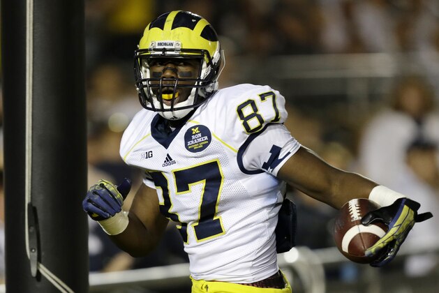 Michigan tight end Devin Funchess (87) scores a touchdown during the fourth quarter of an NCAA college football game against Penn State in State College, Pa., Saturday, Oct. 12, 2013. Penn State won 43-40 in the fourth overtime. (AP Photo/Gene J. Puskar)
