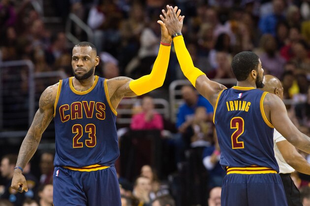CLEVELAND, OH - APRIL 2:  LeBron James #23 and Kyrie Irving #2 of the Cleveland Cavaliers celebrate after scoring during the first half against the Miami Heat at Quicken Loans Arena on April 2, 2015 in Cleveland, Ohio. NOTE TO USER: User expressly acknowledges and agrees that, by downloading and or using this photograph, User is consenting to the terms and conditions of the Getty Images License Agreement. (Photo by Jason Miller/Getty Images)