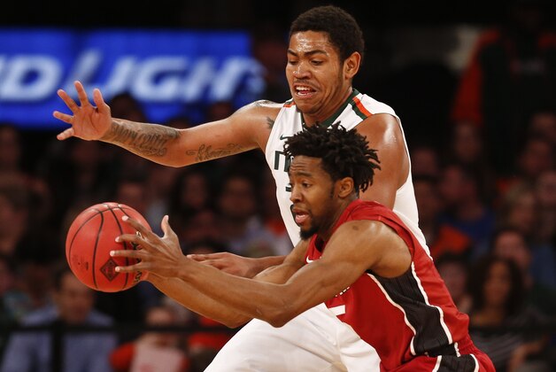 NEW YORK, NY - APRIL 02:  Omar Sherman #22 of the Miami Hurricanes guards Chasson Randle #5 of the Stanford Cardinal during the NIT Championship at Madison Square Garden on April 2, 2015 in New York City.  (Photo by Jeff Zelevansky/Getty Images)