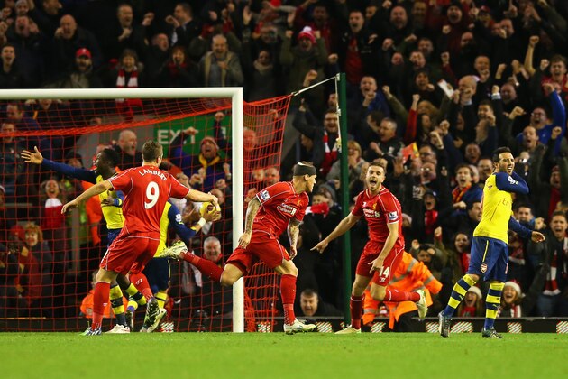 LIVERPOOL, ENGLAND - DECEMBER 21:  Martin Skrtel of Liverpool celebrates scoring his goal with team mates during the Barclays Premier League match between Liverpool and Arsenal at Anfield on December 21, 2014 in Liverpool, England.  (Photo by Alex Livesey/Getty Images)