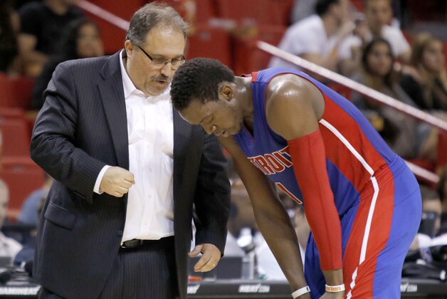 Detroit Pistons head coach Stan Van Gundy speaks with Reggie Jackson during a time out as the Pistons met the Miami Heat in an NBA basketball game, Sunday, March 29, 2015, in Miami. (AP Photo/Joe Skipper)