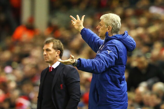 LIVERPOOL, ENGLAND - DECEMBER 21: Arsene Wenger, manager of Arsenal gestures with Brendan Rodgers, manager of Liverpool during the Barclays Premier League match between Liverpool and Arsenal at Anfield on December 21, 2014 in Liverpool, England.  (Photo by Alex Livesey/Getty Images)
