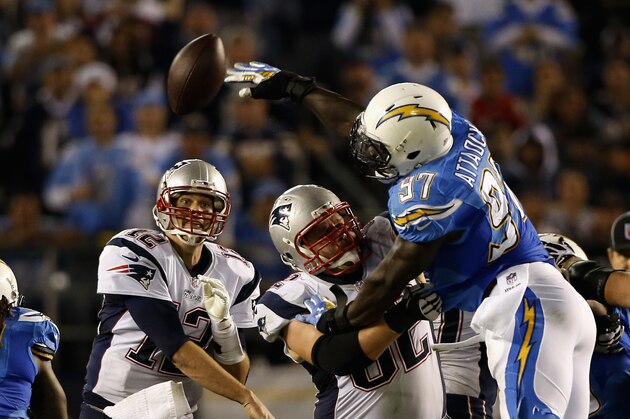 SAN DIEGO, CA - DECEMBER 07:  Outside linebacker Jeremiah Attaochu #97 of the San Diego Chargers knocks down a pass thrown by quarterback Tom Brady #12 of the New England Patriots at Qualcomm Stadium on December 7, 2014 in San Diego, California.  (Photo by Todd Warshaw/Getty Images)