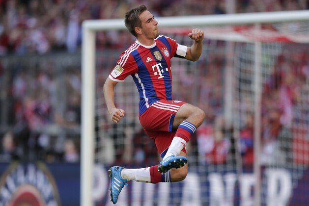 Bayern's Philipp Lahm celebrates after scoring the opening goal during the German first division Bundesliga soccer match between FC Bayern and SV Werder Bremen in the Allianz Arena in Munich, Germany, on Saturday, Oct. 18, 2014. (AP Photo/Matthias Schrader)