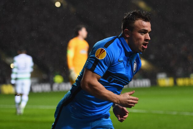 GLASGOW, SCOTLAND - FEBRUARY 19:   Xherdan Shaqiri of Inter Milan celebrates as he scores their first goal during the UEFA Europa League Round of 32 first leg match between Celtic FC and FC Internazionale Milano at Celtic Park Stadium on February 19, 2015 in Glasgow, United Kingdom.  (Photo by Laurence Griffiths/Getty Images)