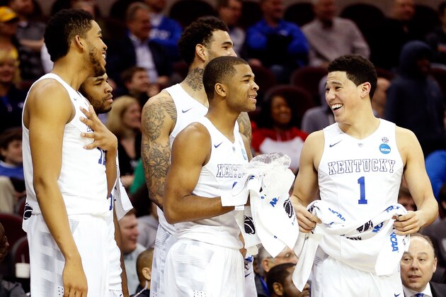 CLEVELAND, OH - MARCH 26: Karl-Anthony Towns #12, Andrew Harrison #5, Willie Cauley-Stein #15, Aaron Harrison #2 and Devin Booker #1 of the Kentucky Wildcats react late in the game from the bench against the West Virginia Mountaineers during the Midwest Regional semifinal of the 2015 NCAA Men's Basketball Tournament at Quicken Loans Arena on March 26, 2015 in Cleveland, Ohio.  (Photo by Gregory Shamus/Getty Images)