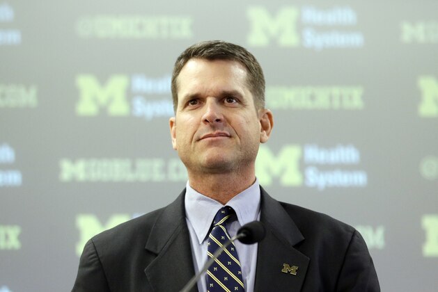 Jim Harbaugh addresses the media after being introduced as the head coach of Michigan in Ann Arbor, Mich., Tuesday, Dec. 30, 2014. The 51-year-old Harbaugh coached the San Francisco 49ers to three straight NFC championship games. (AP Photo/Carlos Osorio)