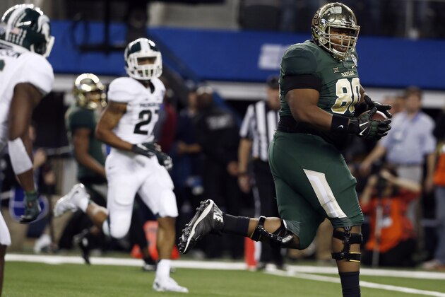 Baylor offensive tackle LaQuan McGowan (80) runs the ball in for a touchdown on a trick play during the second half of the Cotton Bowl NCAA college football game against Michigan State, Thursday, Jan. 1, 2015, in Arlington, Texas. Michigan State won 42-41. (AP Photo/Brandon Wade)