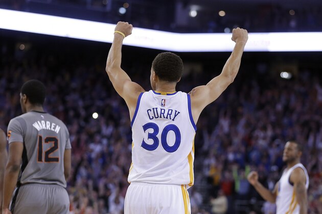 Golden State Warriors' Stephen Curry (30) celebrates at the end of an NBA basketball game against the Phoenix Suns on Thursday, April 2, 2015, in Oakland, Calif. The Warriors won 107-106. (AP Photo/Ben Margot)