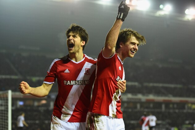 DERBY, ENGLAND - MARCH 17: Patrick Bamford of Middlesbrough (R) celebrates scoring the opening goal during the Sky Bet Championship match between Derby County and Middlesbrough at iPro Stadium on March 17, 2015 in Derby, England.  (Photo by Laurence Griffiths/Getty Images)