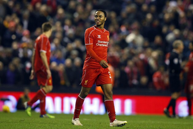 Liverpool's Raheem Sterling grimaces during the English League Cup semi-final first leg soccer match between Liverpool and Chelsea at Anfield Stadium, Liverpool, England, Tuesday Jan. 20, 2015. (AP Photo/Jon Super)