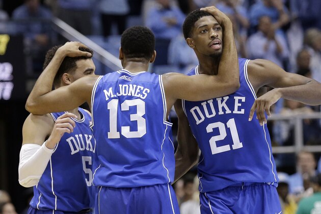 Duke's Tyus Jones (5), Matt Jones (13) and Amile Jefferson (21) celebrate in the closing moments of an NCAA college basketball game against North Carolina, Saturday, March 7, 2015 in Chapel Hill, N.C. Duke won 84-77. (AP Photo/Gerry Broome)