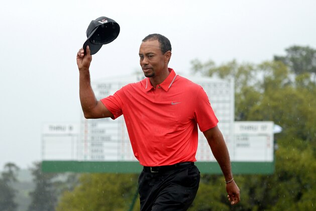 AUGUSTA, GA - APRIL 14:  Tiger Woods of the United States waves to the patrons after the 18th hole during the final round of the 2013 Masters Tournament at Augusta National Golf Club on April 14, 2013 in Augusta, Georgia.  (Photo by Harry How/Getty Images)