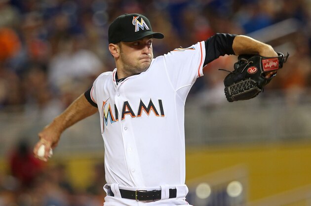 MIAMI, FL - AUGUST 19:  Jarred Cosart #23 of the Miami Marlins pitches during a game against the Texas Rangers at Marlins Park on August 19, 2014 in Miami, Florida.  (Photo by Mike Ehrmann/Getty Images)