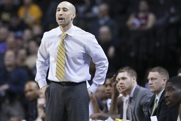 VCU head coach Shaka Smart directs his players from the bench during the first half of an NCAA college basketball game against Richmond in the quarterfinal round of the Atlantic 10 Conference tournament at the Barclays Center in New York, Friday, March 14, 2014. VCU defeated Richmond, 71-53. (AP Photo/John Minchillo)