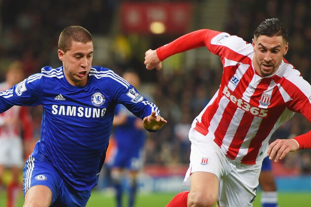 STOKE ON TRENT, ENGLAND - DECEMBER 22:  Eden Hazard of Chelsea is chased by Geoff Cameron of Stoke City during the Barclays Premier League match between Stoke City and Chelsea at Britannia Stadium on December 22, 2014 in Stoke on Trent, England.  (Photo by Michael Regan/Getty Images)