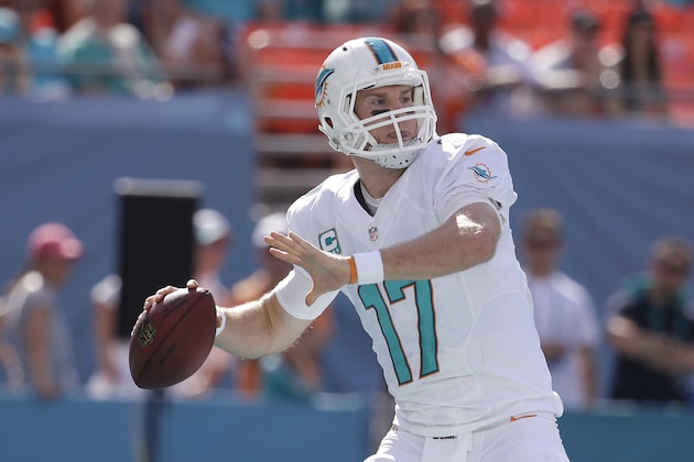 Miami Dolphins quarterback Ryan Tannehill (17) looks to pass during the first half of an NFL football game against the New York Jets, Sunday, Dec. 28, 2014, in Miami Gardens, Fla. (AP Photo/Lynne Sladky)