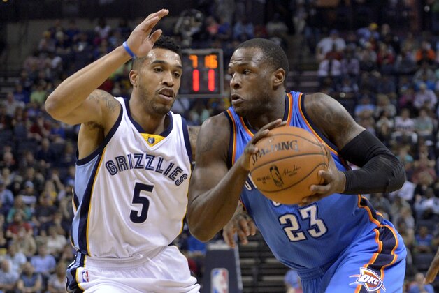 Oklahoma City Thunder guard Dion Waiters (23) drives against Memphis Grizzlies guard Courtney Lee (5) in the first half of an NBA basketball game Friday, April 3, 2015, in Memphis, Tenn. (AP Photo/Brandon Dill)