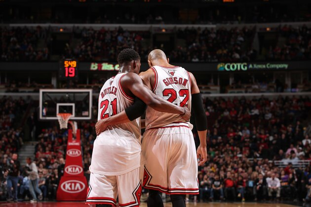 CHICAGO, IL - APRIL 4: Jimmy Butler #21 and Taj Gibson #22 of the Chicago Bulls share a word during the game against the Milwaukee Bucks on April 04, 2014 at the United Center in Chicago, Illinois. NOTE TO USER: User expressly acknowledges and agrees that, by downloading and or using this Photograph, user is consenting to the terms and conditions of the Getty Images License Agreement. Mandatory Copyright Notice: Copyright 2014 NBAE (Photo by Gary Dineen/NBAE via Getty Images)