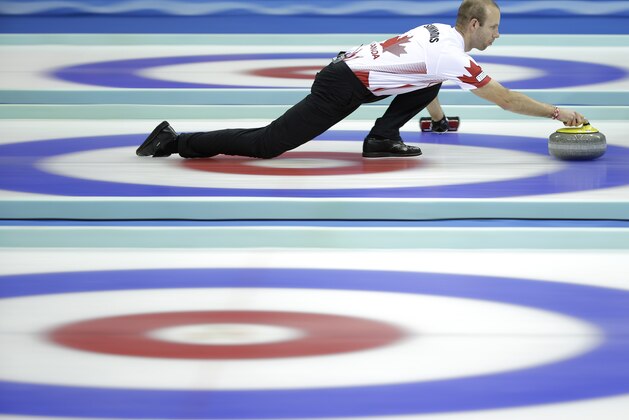 Canada's Pat Simmons delivers the stone during a semi-final match against Sweden at the 2014 World Men's Curling Championship held at the Capital Gymnasium in Beijing, China, Saturday, April 5, 2014. (AP Photo/Alexander F. Yuan)
